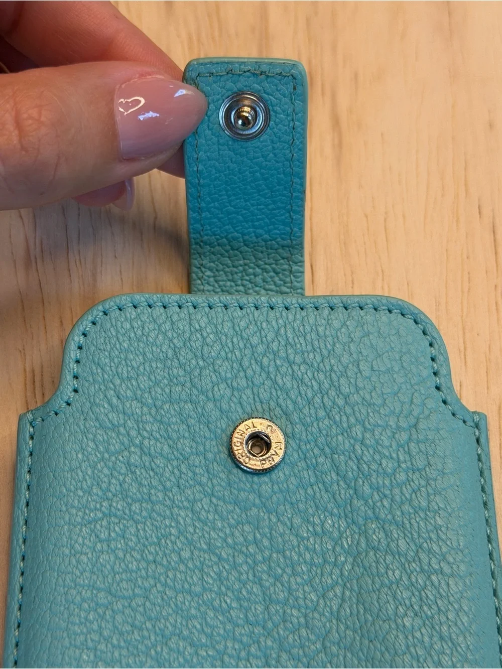 Tiffany & Co. turquoise pebbled leather phone sleeve with gold logo